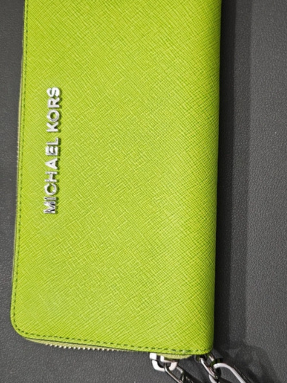 “Like New”. Bright Lime Green Michael Kors Saffiano Leather Wristlet With Strap.